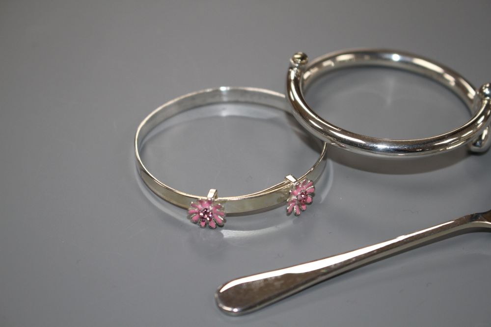 A modern silver coffee spoon and two 925 childs bangles, gross weight 31 grams.